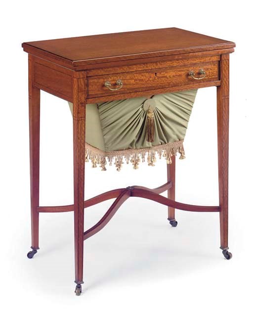 A MAHOGANY SATINWOOD WORK/GAMES TABLE