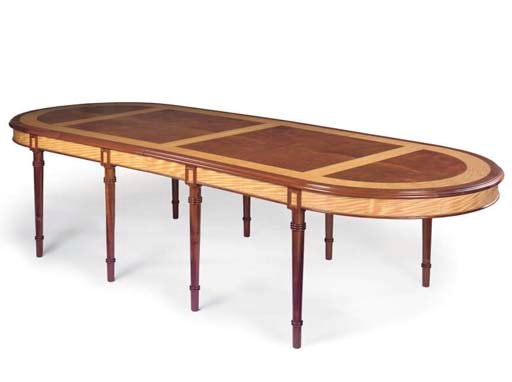 A HARDWOOD DINING TABLE