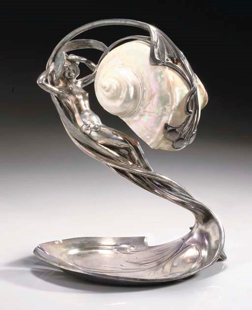A SILVERED METAL AND SHELL FIGURAL TABLE LAMP