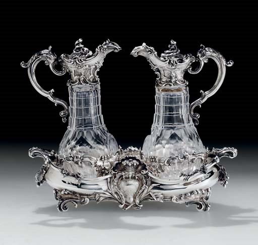 A FINE VICTORIAN SILVER AND CUT-GLASS CRUET STAND