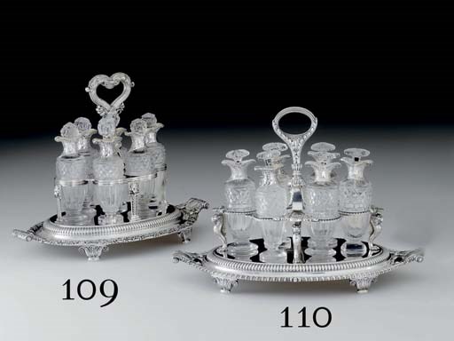 A GEORGE III SILVER AND GLASS CRUET STAND