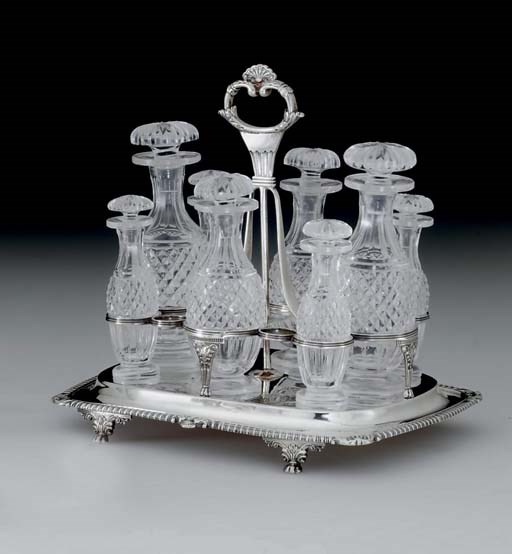 A REGENCY SILVER AND GLASS CRUET STAND