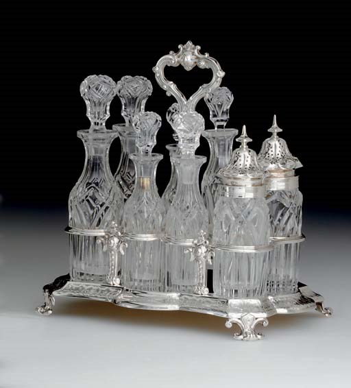 A GEORGE IV SILVER AND GLASS CRUET STAND