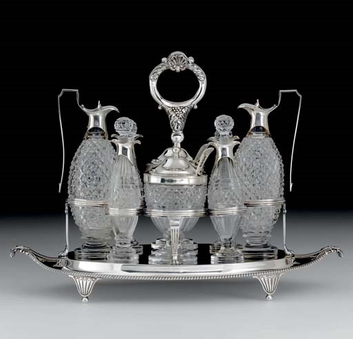 A GEORGE III SILVER AND GLASS CRUET STAND