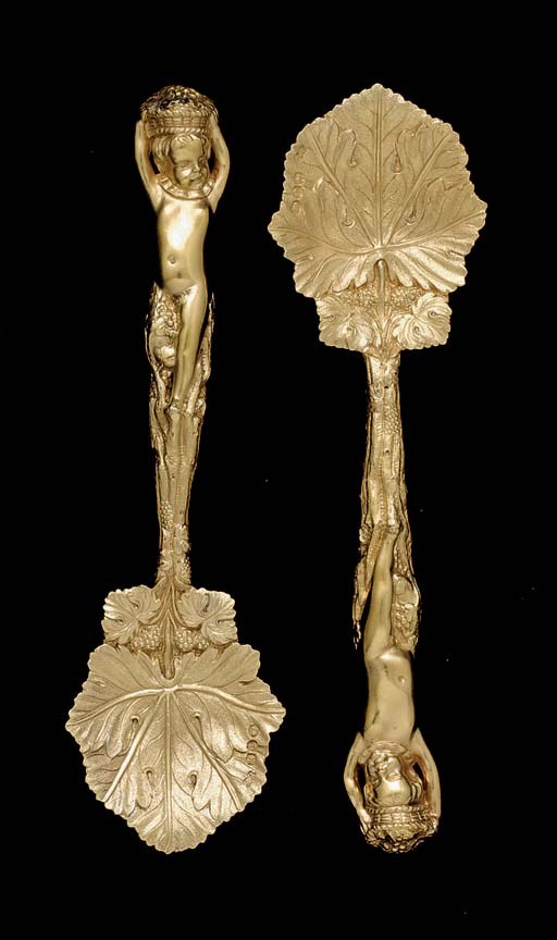 A PAIR OF GEORGE IV SILVER-GILT BERRY SPOONS