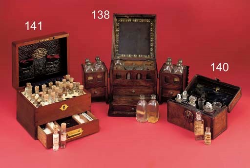 A Continental walnut domestic medicine chest with iron strap-work and mounts,