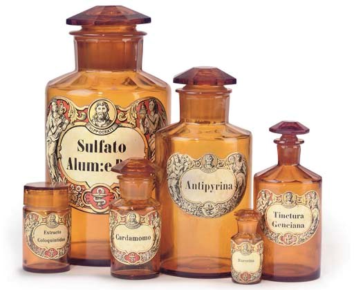 A group of six German amber glass drug runs with stoppers,