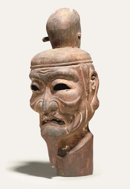 A WOOD CARVING OF A SHINTO KAMI