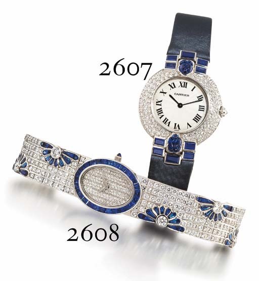 CHAUMET. A RARE LADY'S 18K WHITE GOLD, DIAMOND AND SAPPHIRE-SET OVAL WRISTWATCH WITH BRACELET