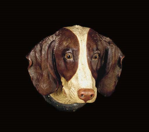 A PAINTED TERRACOTTA BUST OF A SETTER,