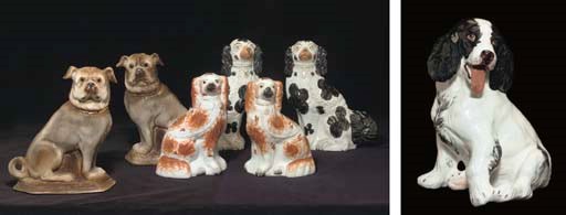 TWO PAIRS OF STAFFORDSHIRE MODELS OF SPANIELS AND A PAIR OF ENGLISH EARTHENWARE MODELS OF PUGS