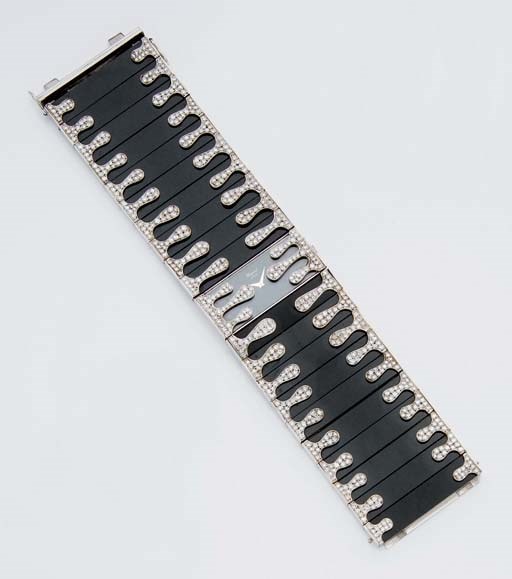 MONTRE BRACELET DE DAME MANCHETTE ONYX ET DIAMANTS, PAR CHOPARD