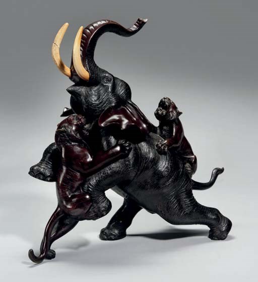 A large Japanese bronze of an elephant with tigers, 19th Century