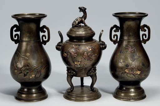 A Japanese three-piece bronze inlaid garniture, 19th century