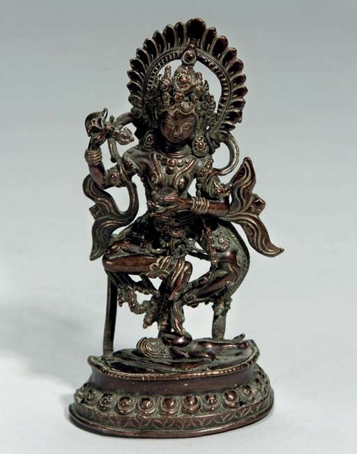 A Tibetan bronze model of a dakini, 18th Century or earlier