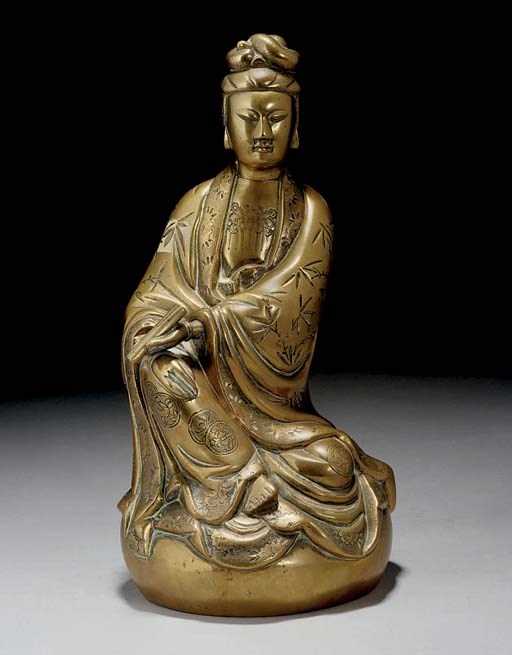 A Chinese bronze model of Guanyin, 19th/20th Century