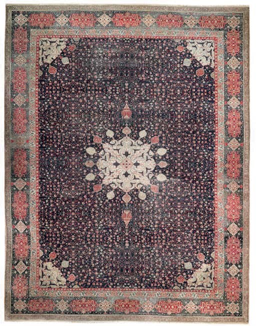 A very fine antique Agra carpet