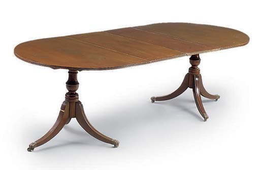 A MAHOGANY TWIN PEDESTAL DINING TABLE