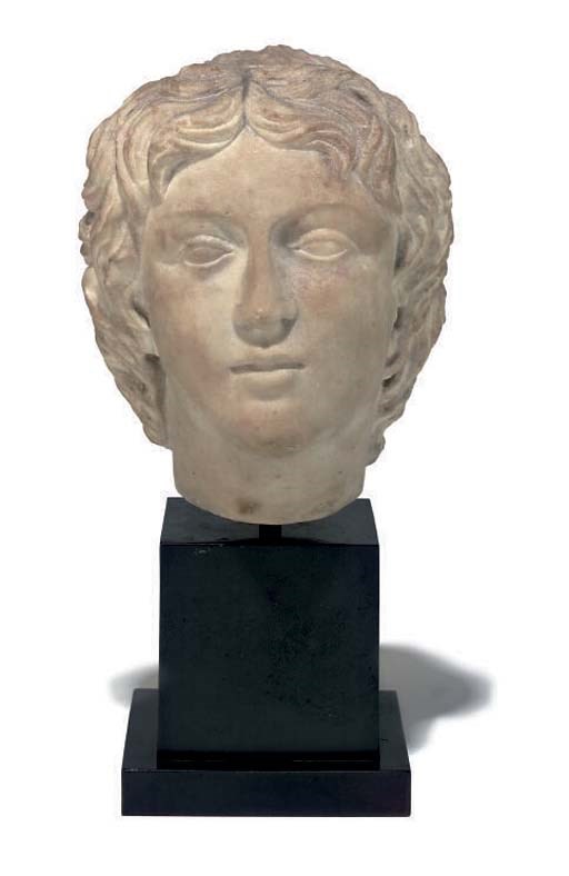 A CARVED MARBLE BUST OF A YOUNG BOY