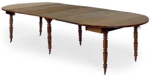 A FRENCH WALNUT EXTENDING DROP LEAF DINING TABLE