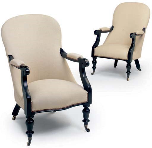 A PAIR OF EBONISED ARMCHAIRS