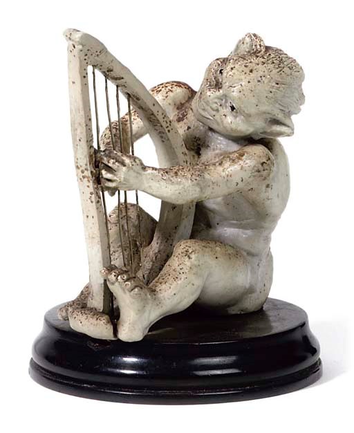 MARTIN BROTHERS: IMP MUSICIAN PLAYING A HARP