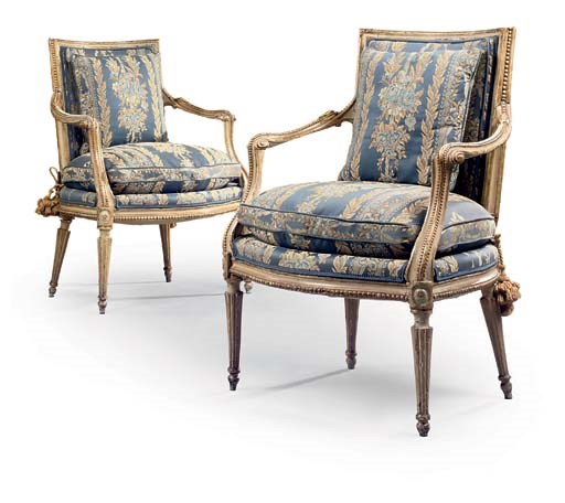 A PAIR OF SOUTH ITALIAN CREAM-PAINTED AND PARCEL-GILT OPEN ARMCHAIRS