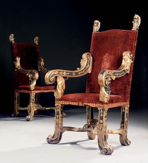 A PAIR OF NORTH ITALIAN PARCEL-GILT AND EBONISED OPEN ARMCHAIRS