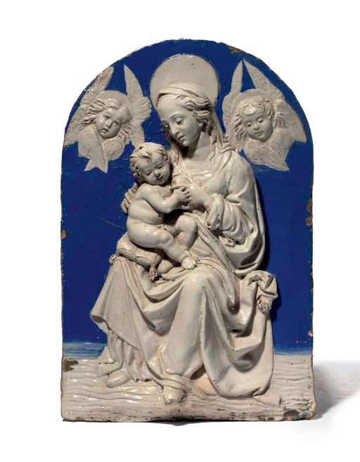 A GLAZED TERRACOTTA RELIEF OF THE VIRGIN AND CHILD ENTHRONED