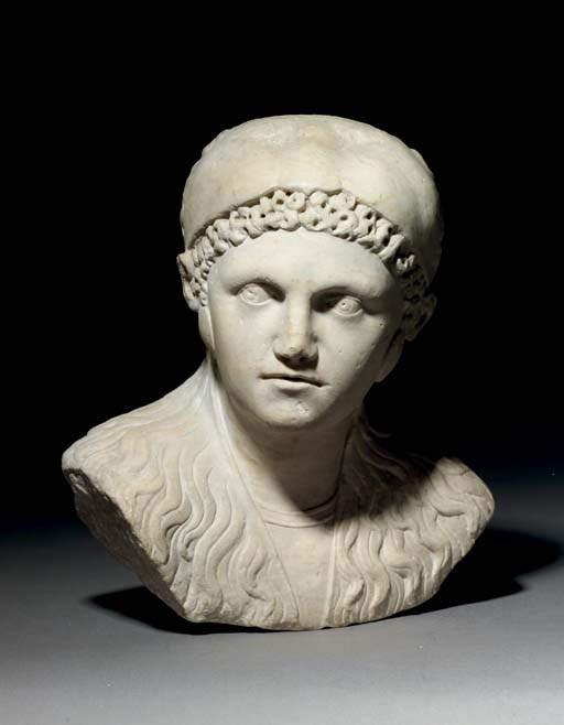 A CARVED MARBLE BUST OF HERCULES