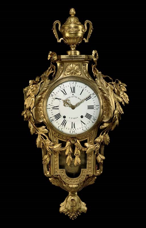 A LATE LOUIS XV ORMOLU CARTEL CLOCK