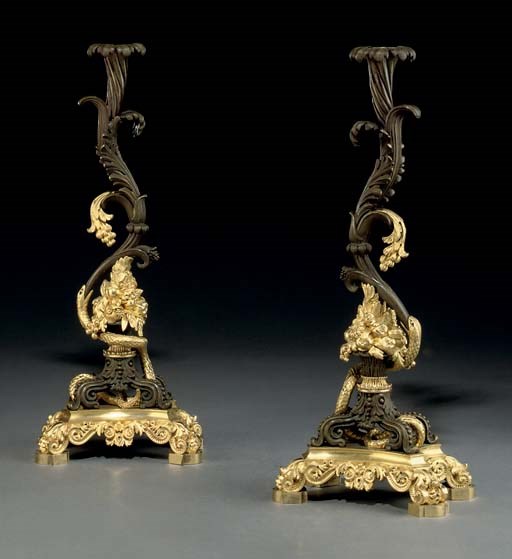 A PAIR OF NORTH EUROPEAN ORMOLU AND BRONZE CANDLESTICKS