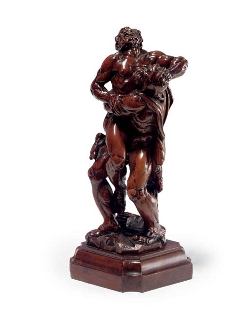 A CARVED BOXWOOD GROUP OF HERCULES AND ANTAEUS