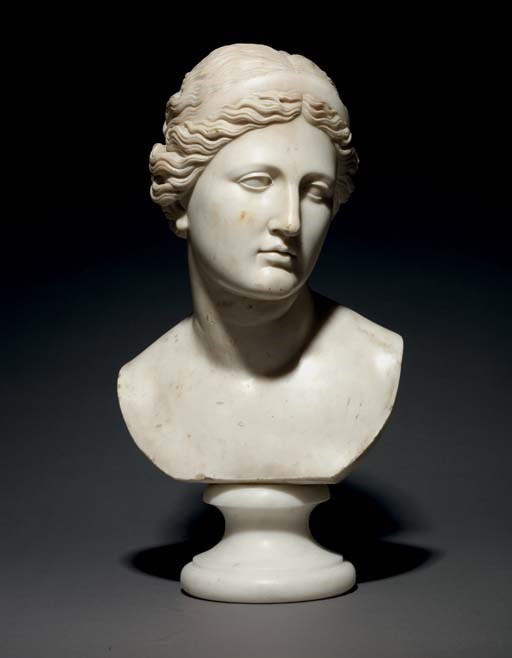 A CARVED MARBLE BUST OF A WOMAN