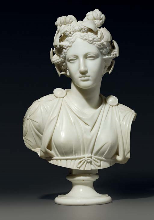 A CARVED MARBLE BUST OF THALIA