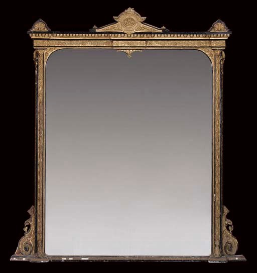 A LATE VICTORIAN GILT AND EBONISED OVERMANTEL MIRROR