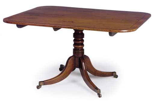 A REGENCY MAHOGANY AND CROSSBANDED BREAKFAST TABLE