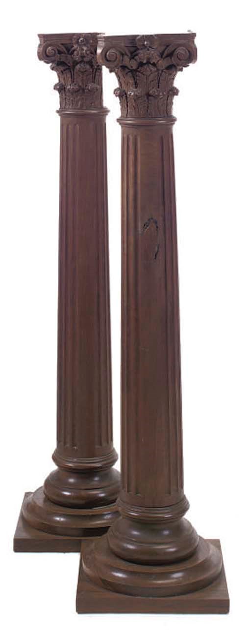 A PAIR OF WALNUT CORINTHIAN COLUMN PEDESTALS