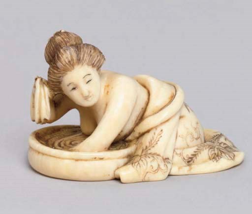 A Japanese ivory netsuke of a young woman signed Yoshiyuki, 19th Century