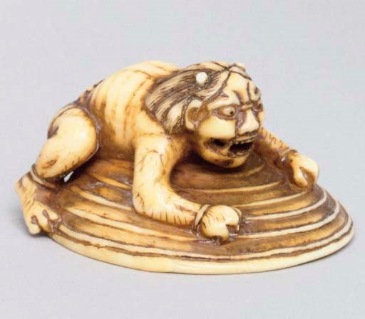 A Japanese ivory netsuke of an oni, late 19th century