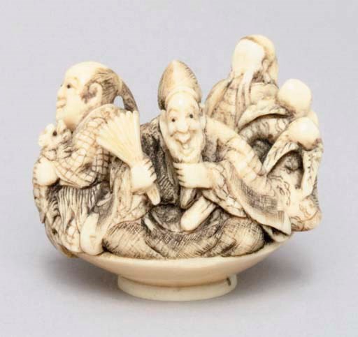 A Japanese ivory netsuke of three legendary figures of Japan, signed Yoshitomo, early 19th Century