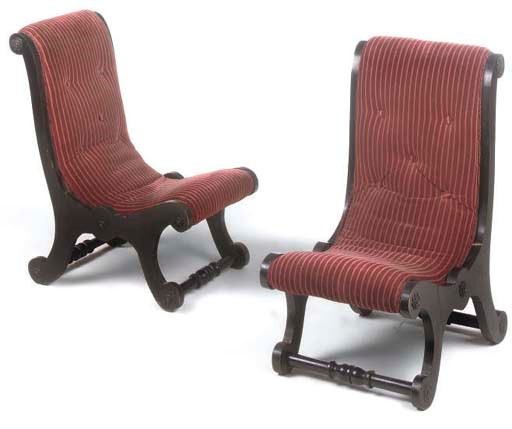 A PAIR OF VICTORIAN EBONISED LOW CHAIRS