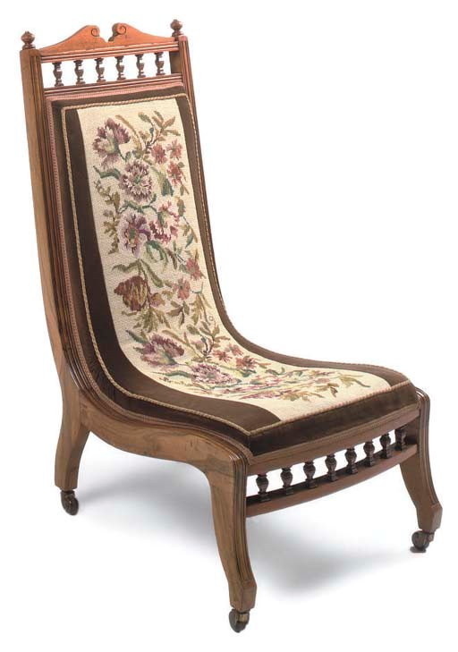 A LATE VICTORIAN WALNUT NURSING CHAIR