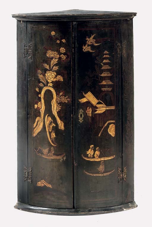 A DUTCH BLACK AND GILT-JAPANNED CORNER CUPBOARD