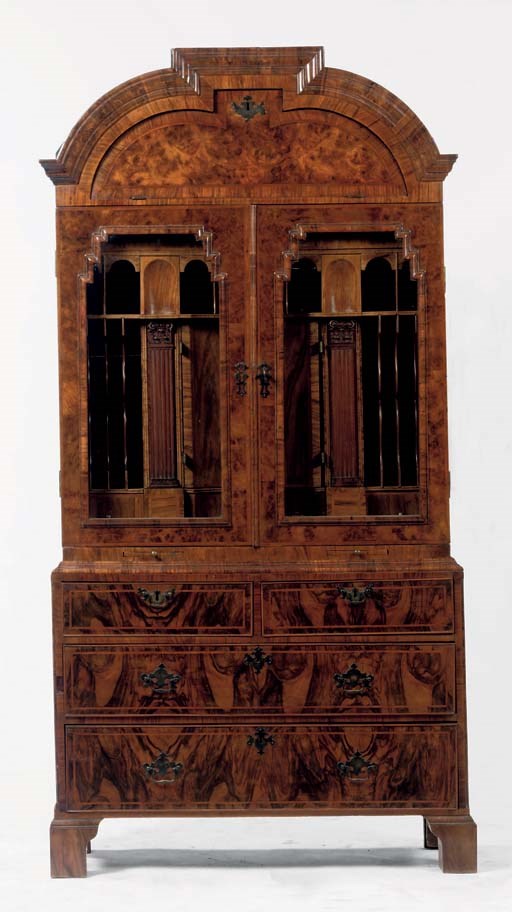 A ENGLISH BRASS-MOUNTED FIGURED WALNUT CABINET