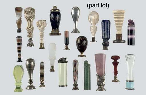 An interesting collection of seventy various ivory, mother-of-pearl, soapstone and glass agathe seals, and a lava cameo brooch