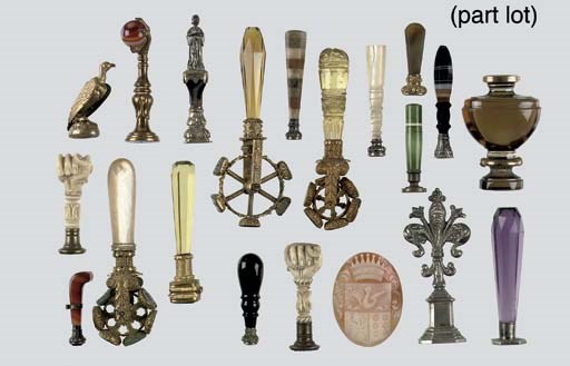 A collection of sixty-four various ivory, agathe and gilt-metal signets and a cameo shell plaque