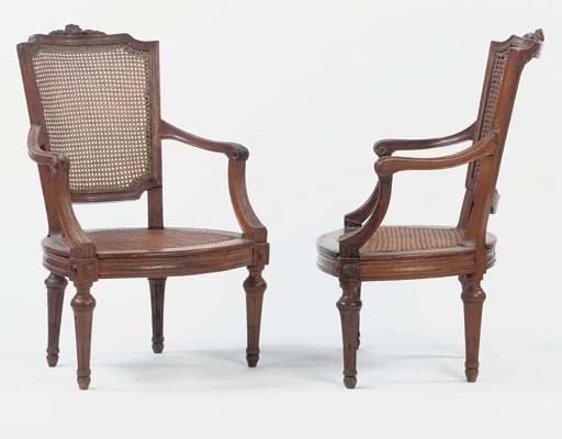 A PAIR OF NORTH ITALIAN WALNUT ARMCHAIRS