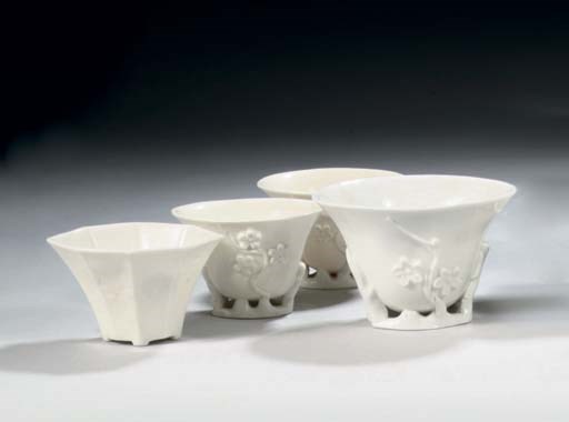 Three Chinese blanc-de-chine 'magnolia' libation cups and an octagonal cup