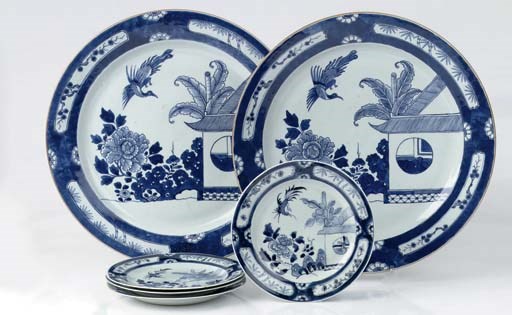 A pair of Chinese blue and white chargers and a set of four plates